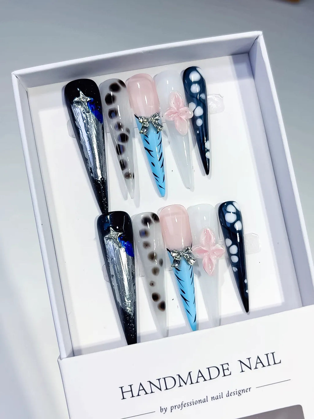 Black White Blue Silver Nude Abstract Bow Star Animal Print Glitter press on nails angled view