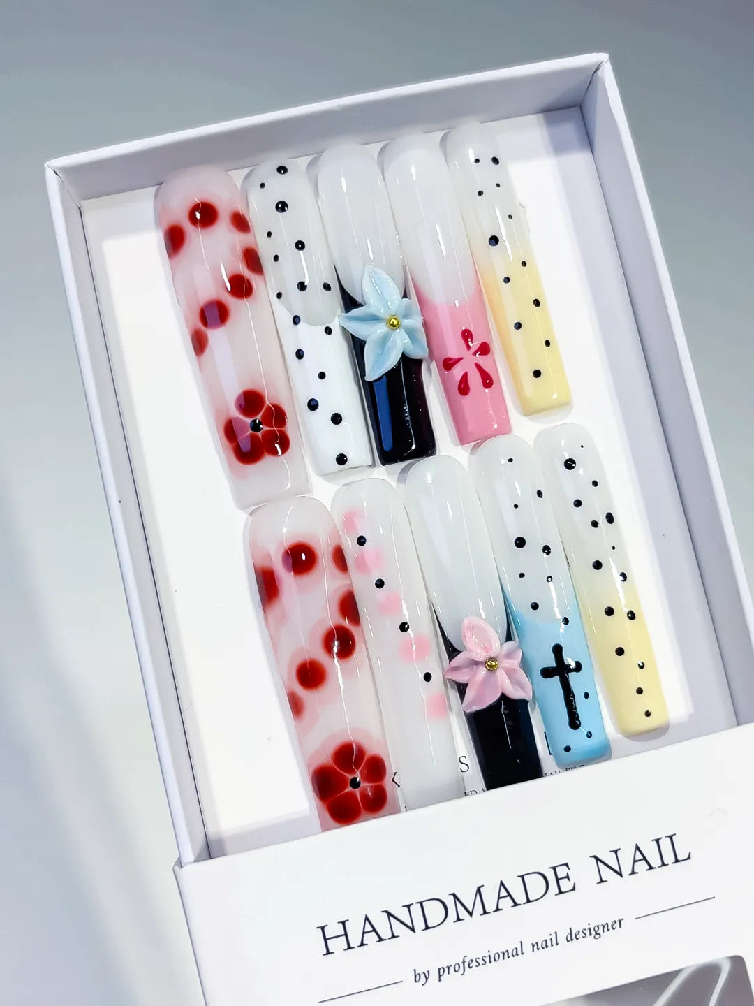 White Red Black Pink Blue Yellow Abstract Flower Cross Dot 3D press on nails angled view