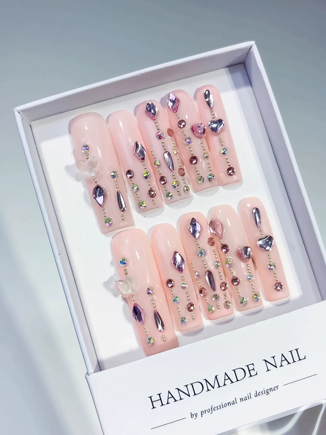 Pink Purple Silver Solid color Heart Rhinestone Shell 3D press on nails angled view