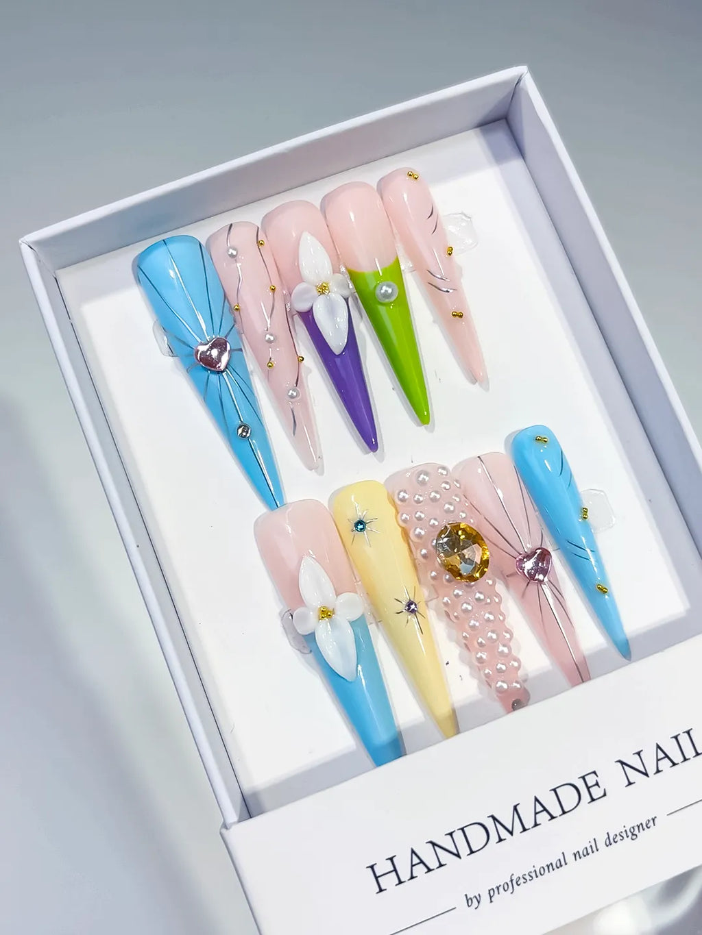 Blue Nude Pink Purple Green Yellow White Gold Abstract Flower Pearl Heart Rhinestone 3D press on nails angled view