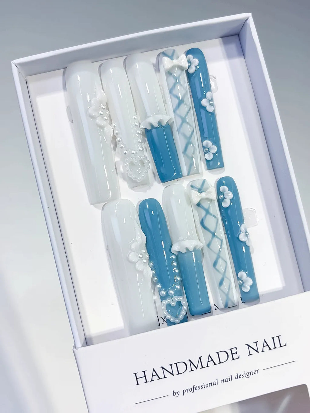 White Blue French tip Pearl Bow Flower Heart 3D press on nails angled view
