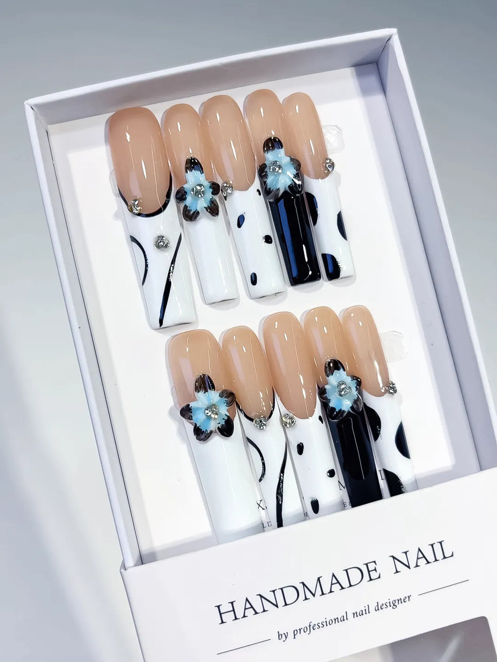 Nude White Black Blue Silver Abstract Flower Rhinestone Metallic Accent 3D press on nails angled view