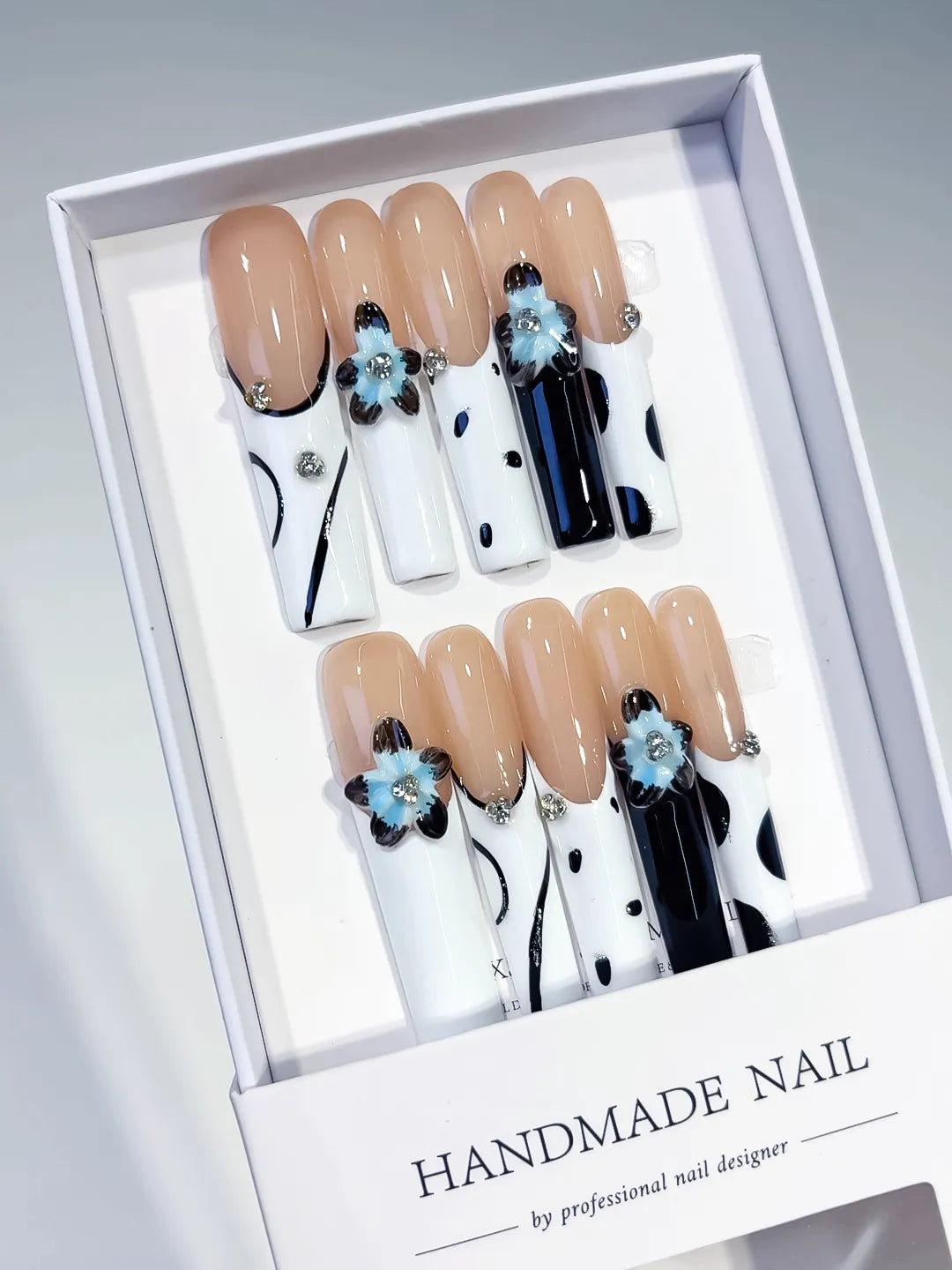 Nude White Black Blue Silver Abstract Flower Rhinestone Metallic Accent 3D press on nails angled view