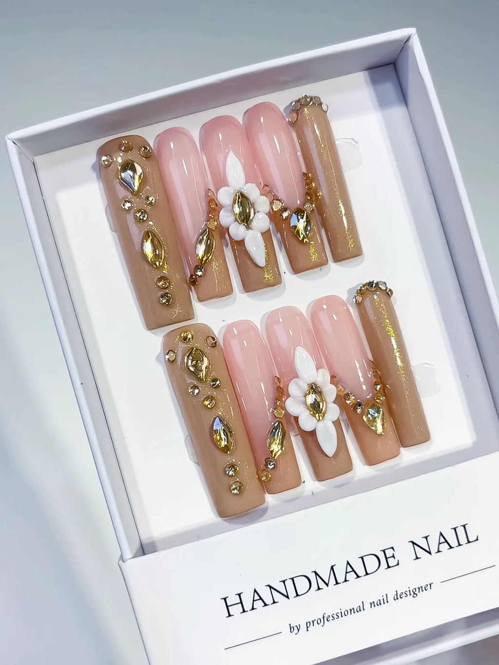 Nude Pink Gold White Solid color Flower Rhinestone Metallic Accent 3D press on nails angled view