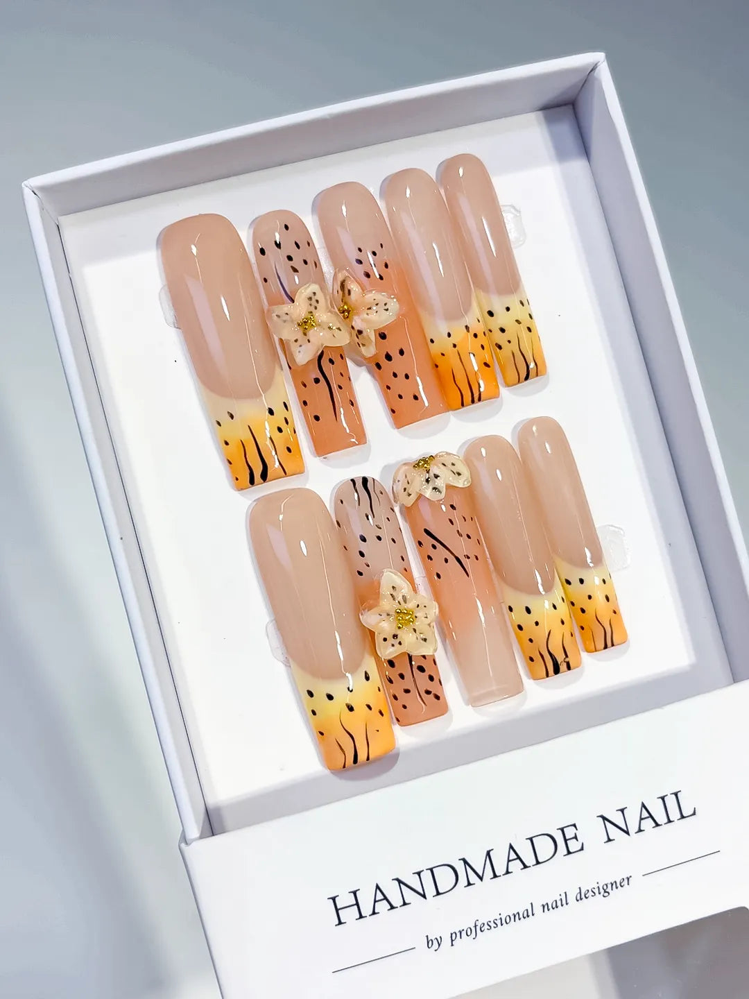 Nude Orange Yellow Black Abstract Flower Animal Print 3D press on nails angled view