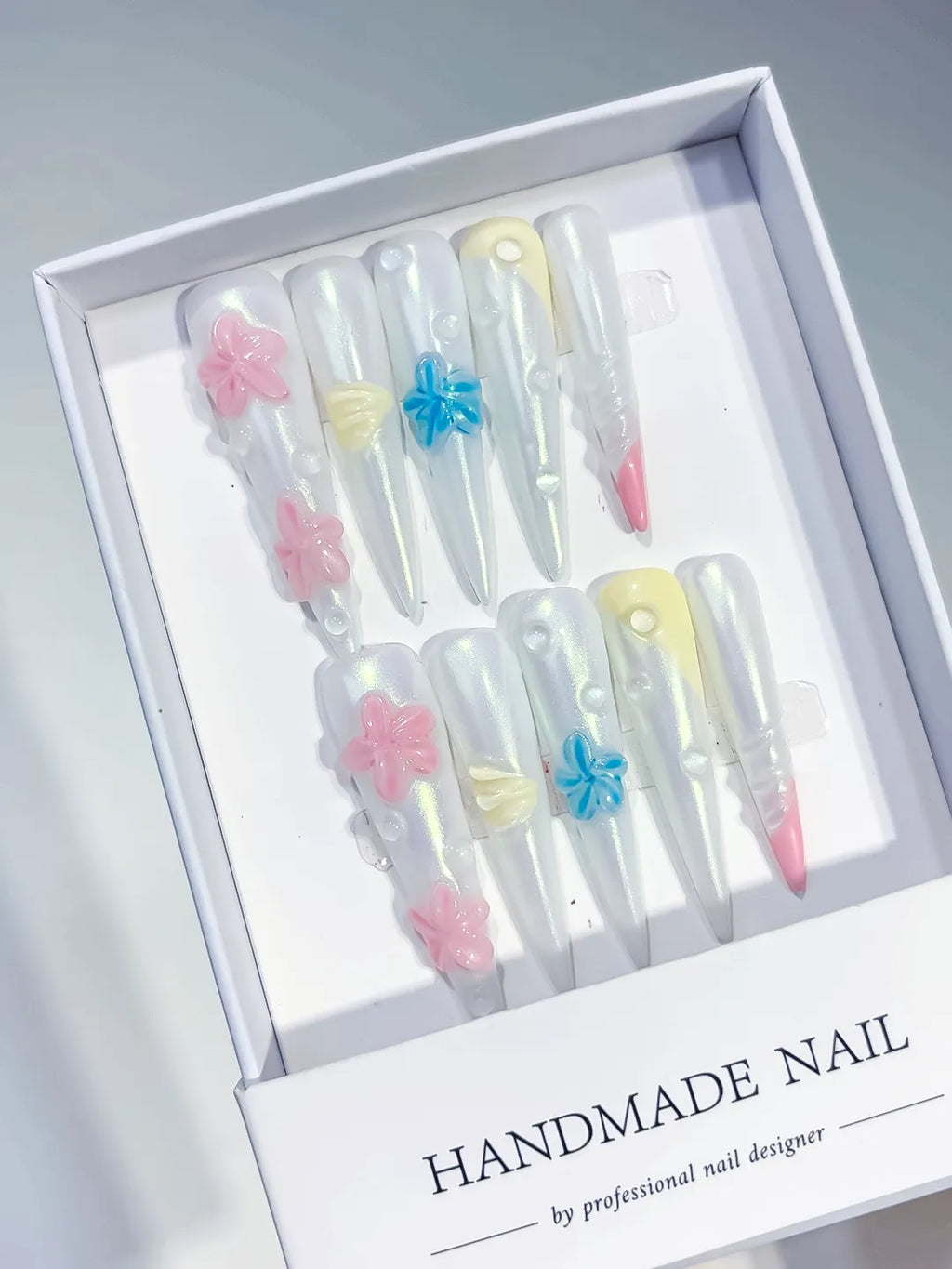 White Pink Blue Yellow Multicolor Holographic Flower Pearl Shell 3D press on nails angled view