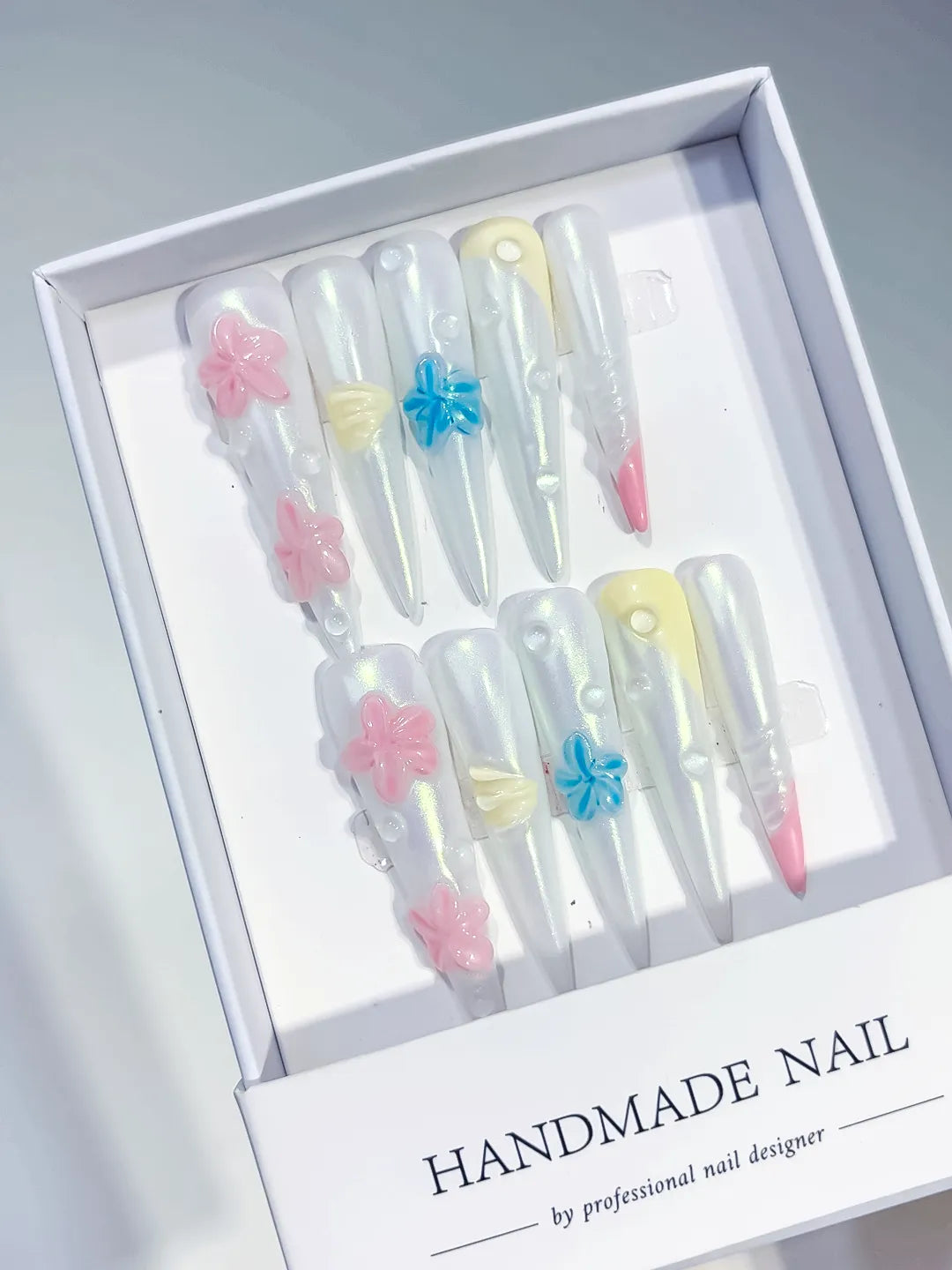 White Pink Blue Yellow Multicolor Holographic Flower Pearl Shell 3D press on nails angled view