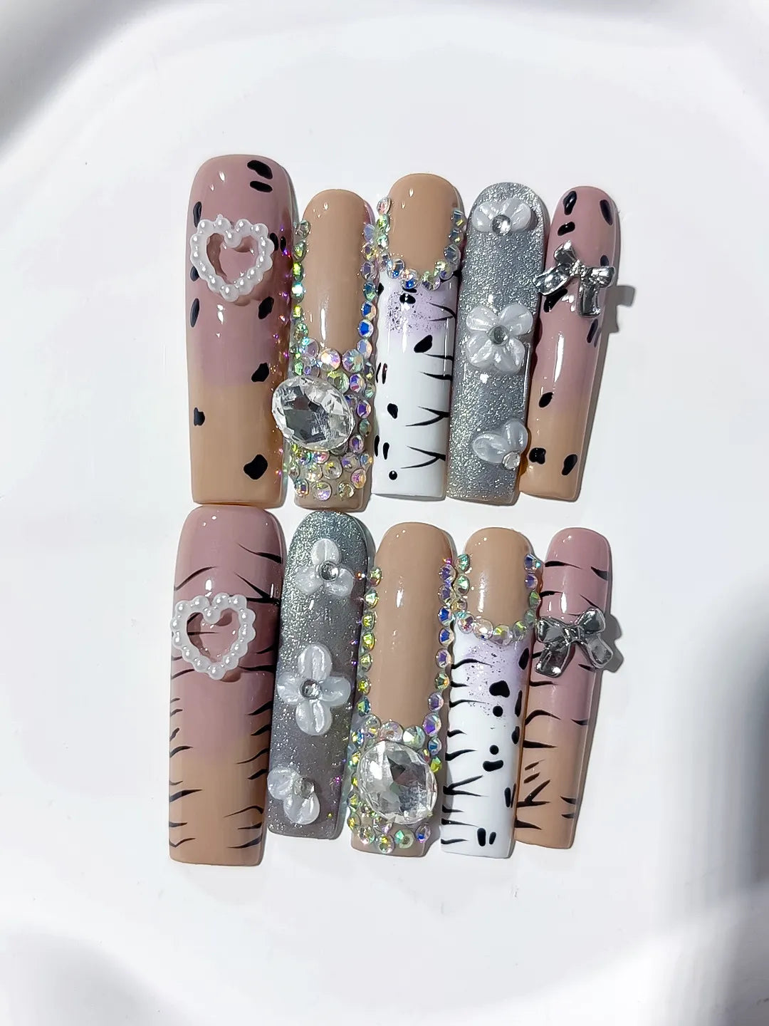Nude White Silver Black Glitter Heart Bow Pearl Rhinestone Animal Print 3D press on nails close up