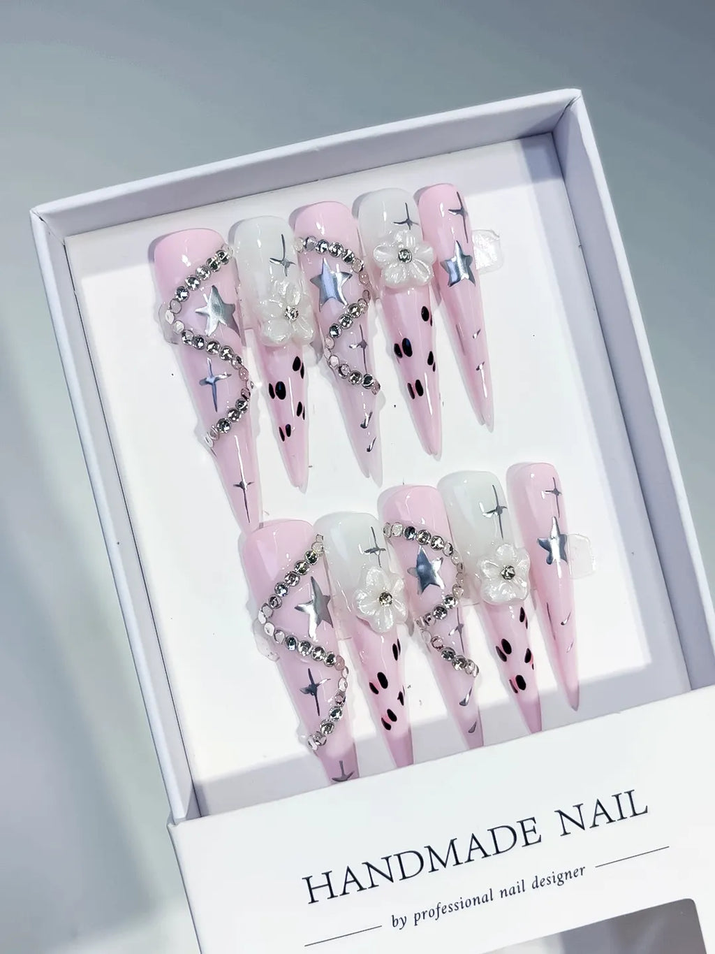 Pink White Silver Black Abstract Star Flower Rhinestone Chain 3D press on nails angled view