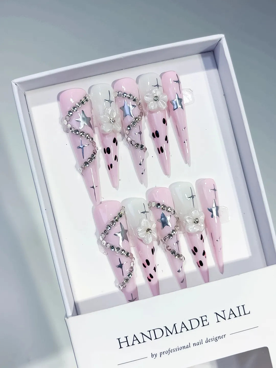 Pink White Silver Black Abstract Star Flower Rhinestone Chain 3D press on nails angled view