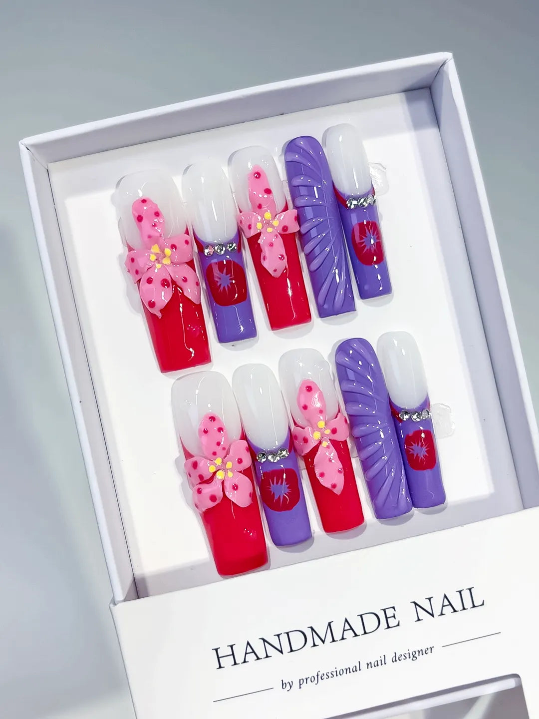 Pink White Purple Silver Abstract Flower Rhinestone 3D press on nails angled view