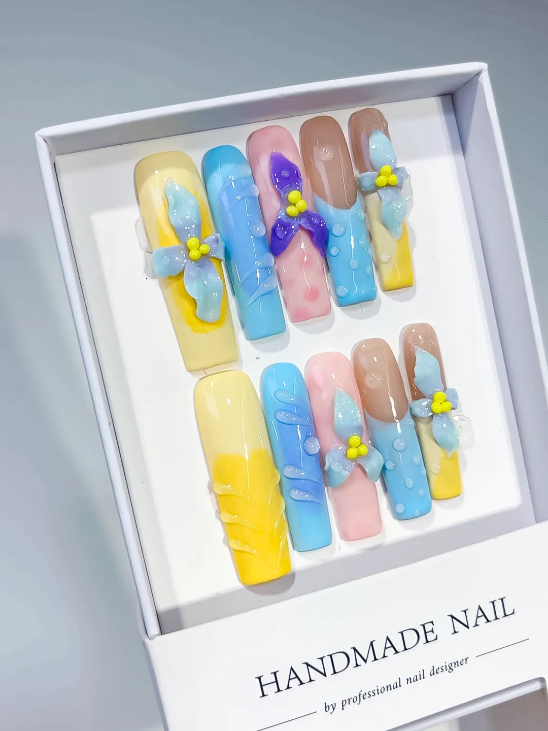 Yellow Blue Pink Nude Purple Abstract Bow Flower Dot 3D press on nails angled view