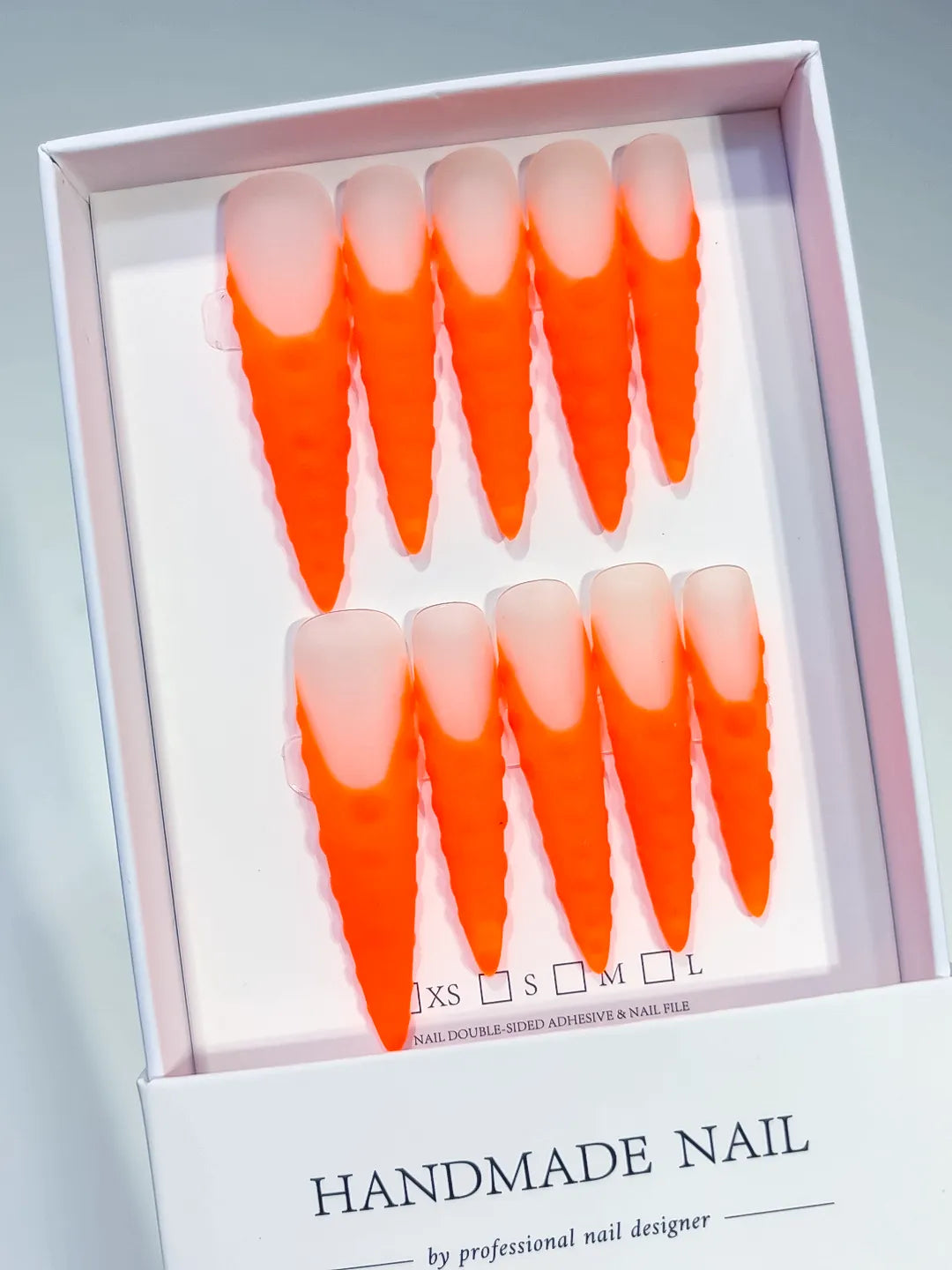 Orange Nude Ombre press on nails angled view