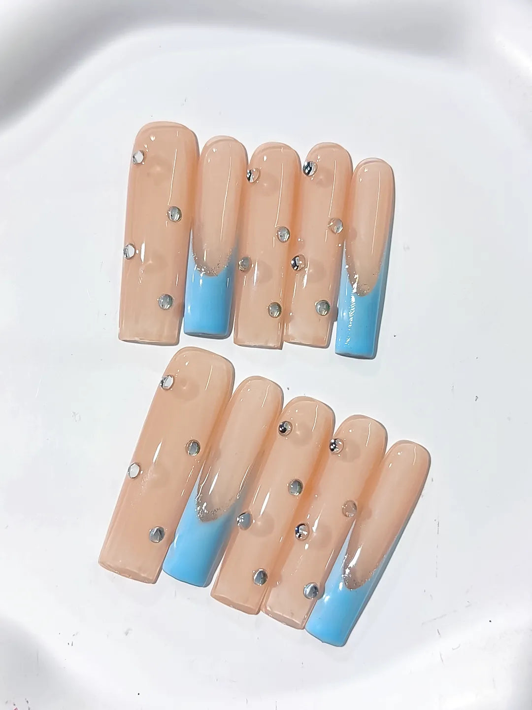 Nude Blue Silver French tip Rhinestone press on nails close up