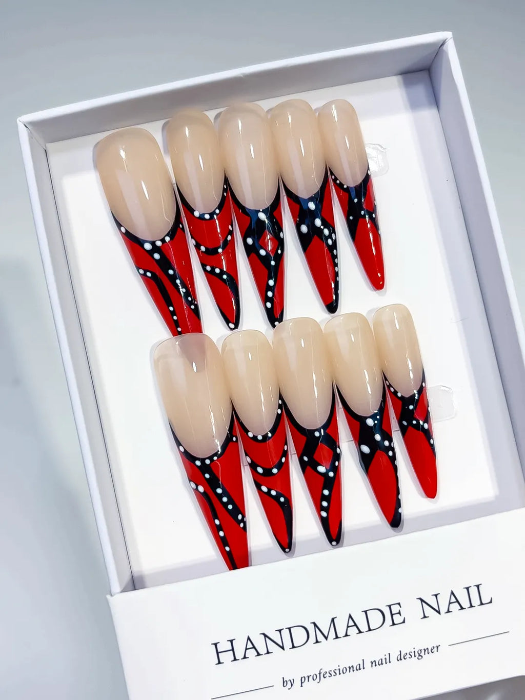 Nude Red Black White Abstract Dot press on nails angled view