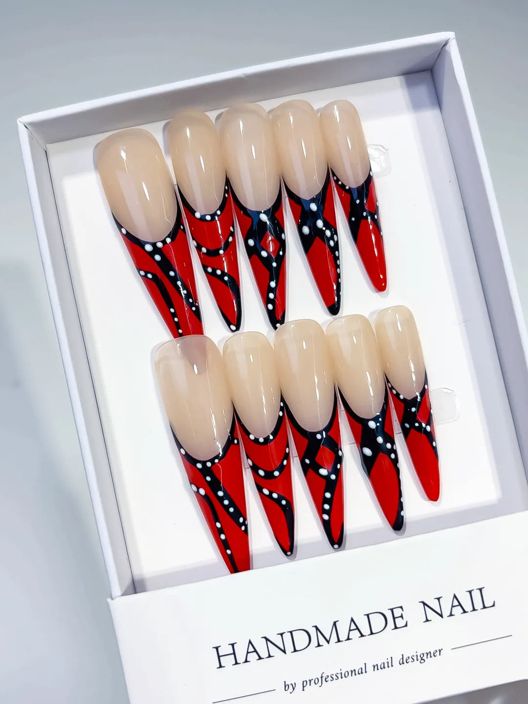 Nude Red Black White Abstract Dot press on nails angled view