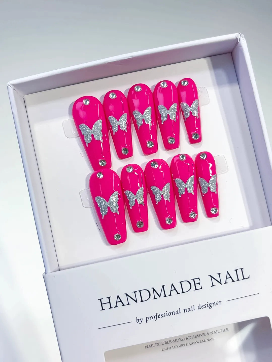 Pink Silver Solid color Butterfly Rhinestone press on nails angled view
