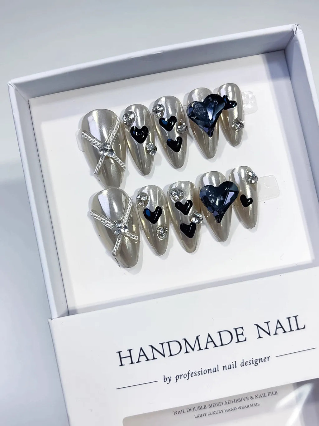 Silver Black Blue Metallic Heart Bow Rhinestone 3D press on nails angled view
