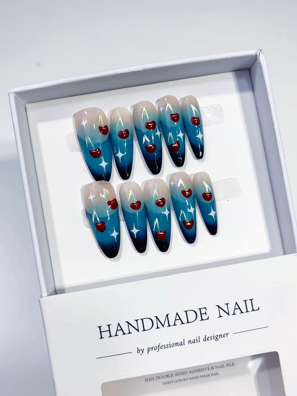 Blue Nude White Red Floral Cherry Star press on nails angled view