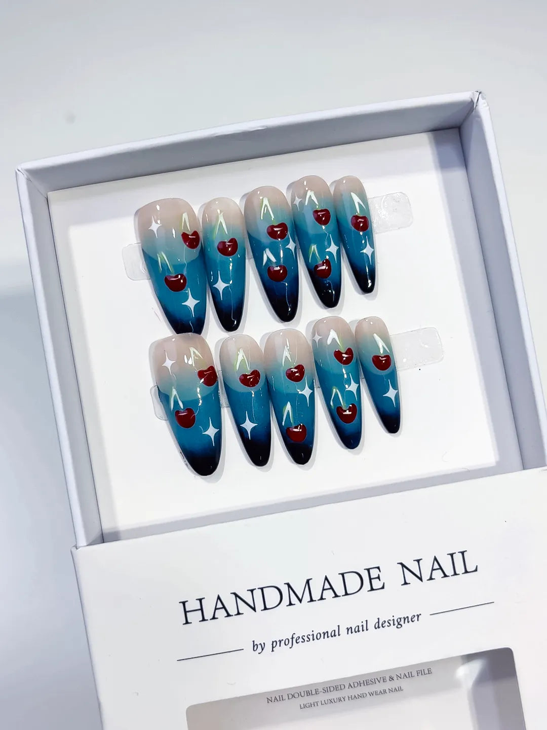 Blue Nude White Red Floral Cherry Star press on nails angled view