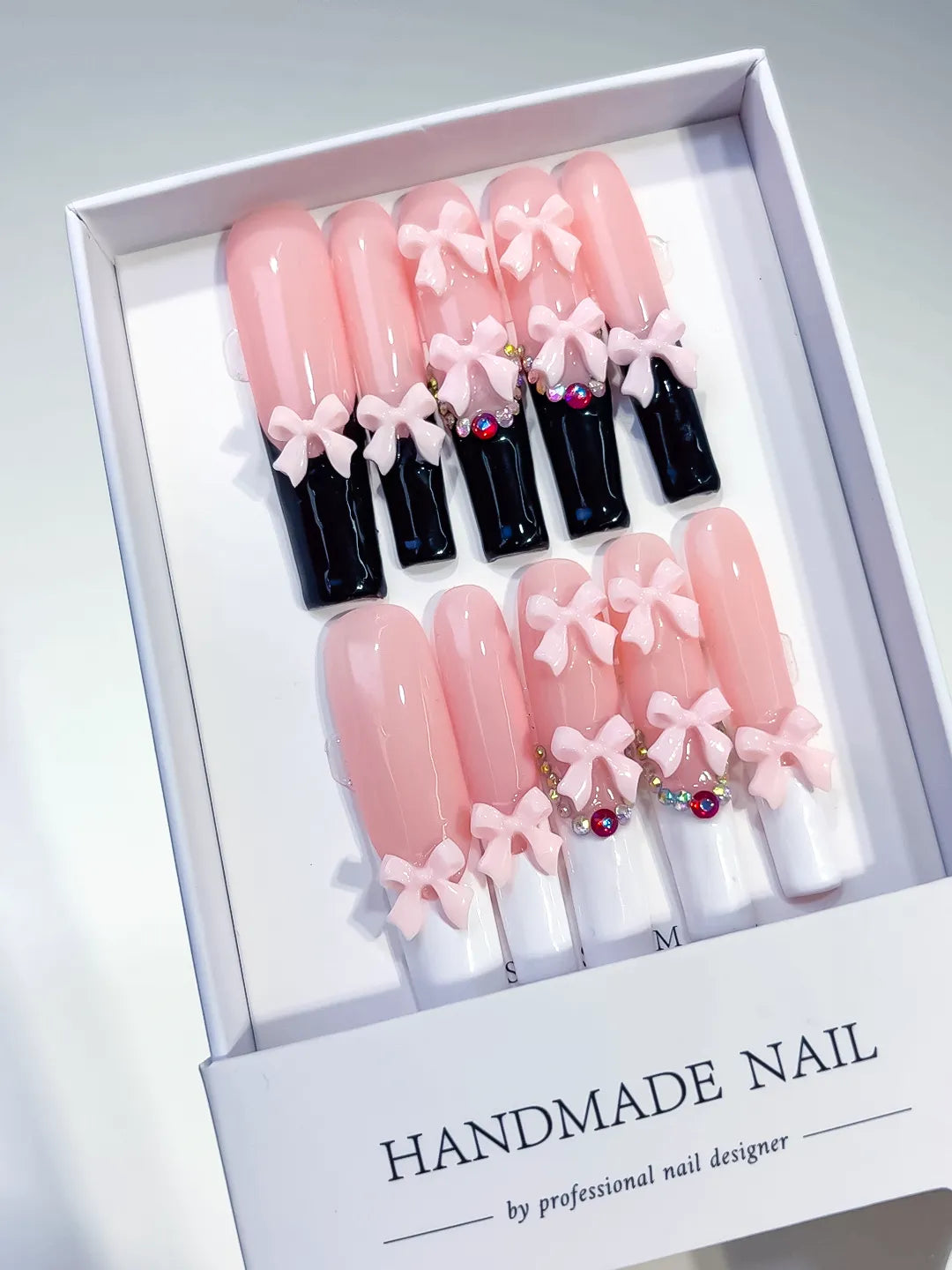 Pink Black White Multicolor French tip Bow Rhinestone 3D press on nails angled view