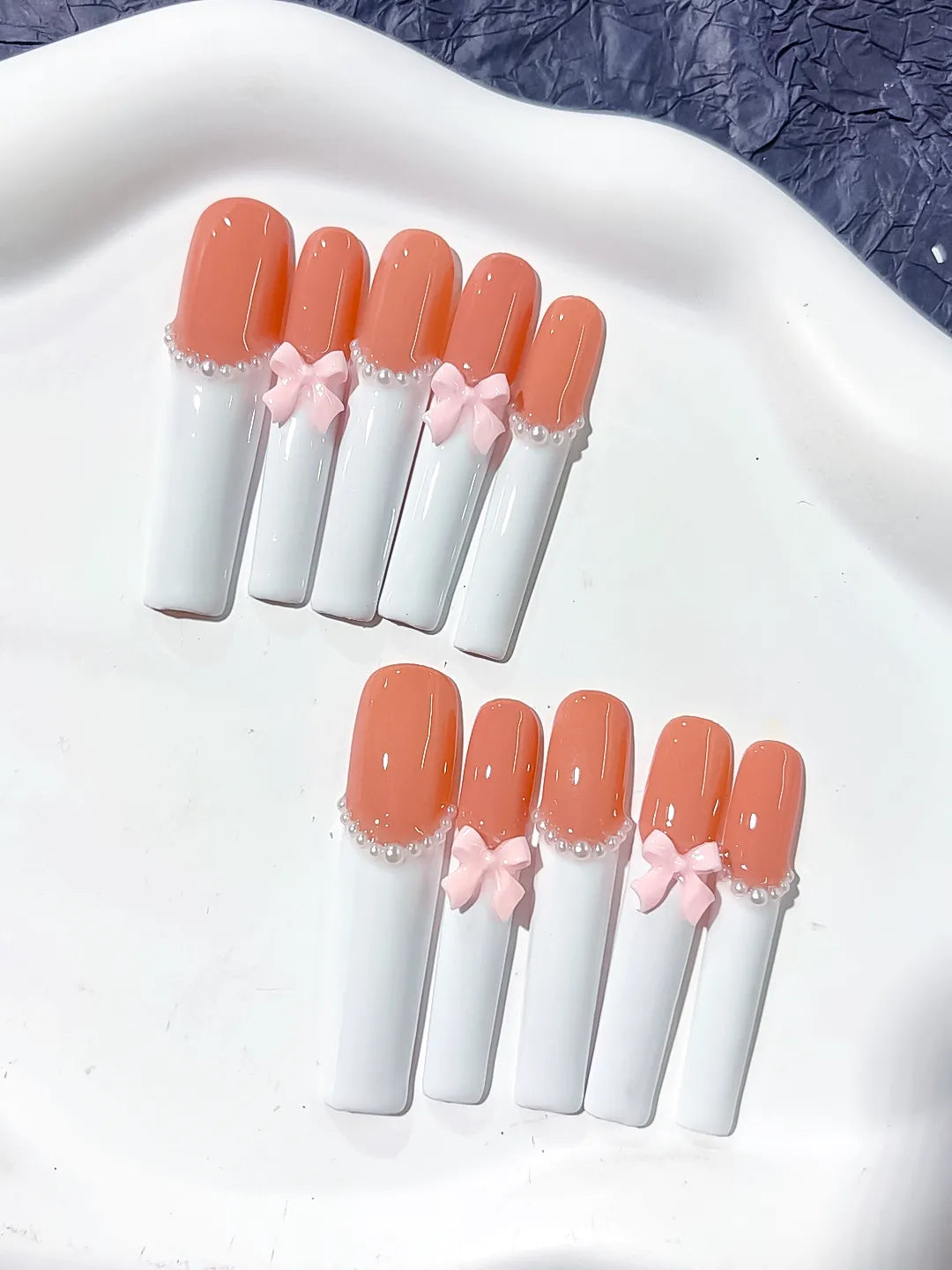 Orange White Pink French tip Bow Pearl 3D press on nails close up