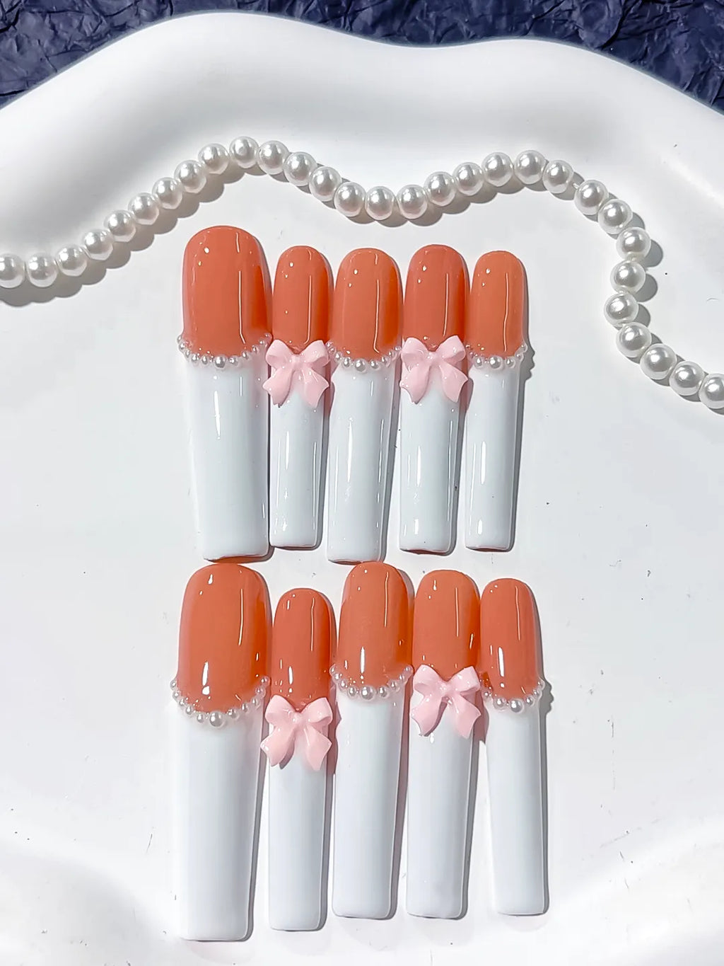 Orange White Pink French tip Bow Pearl 3D press on nails detail view