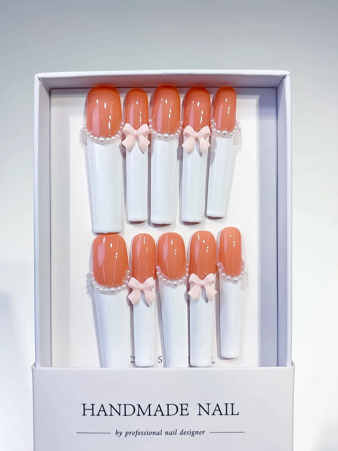 Orange White Pink French tip Bow Pearl 3D press on nails full set view
