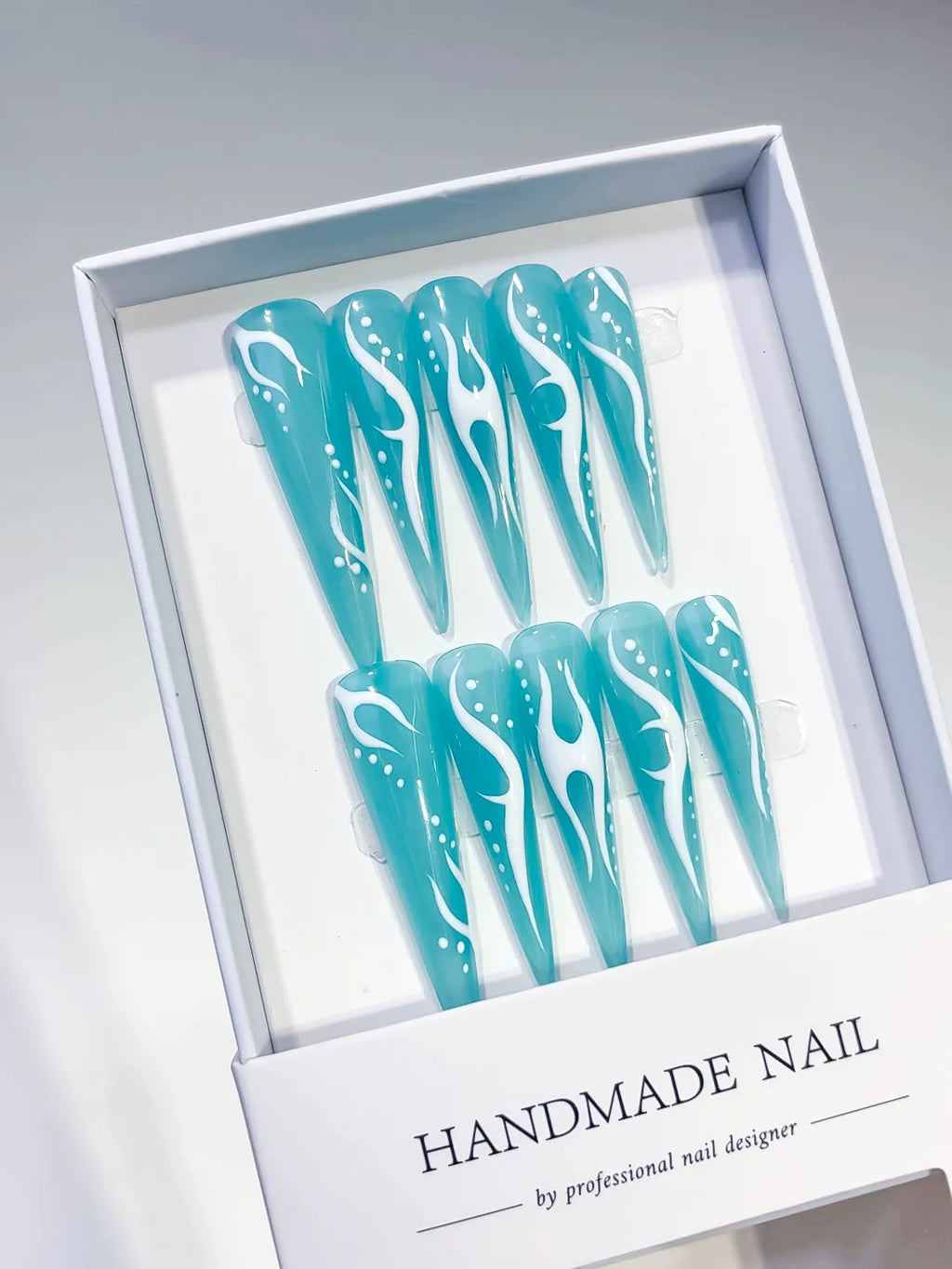 Blue White Abstract Flame press on nails angled view