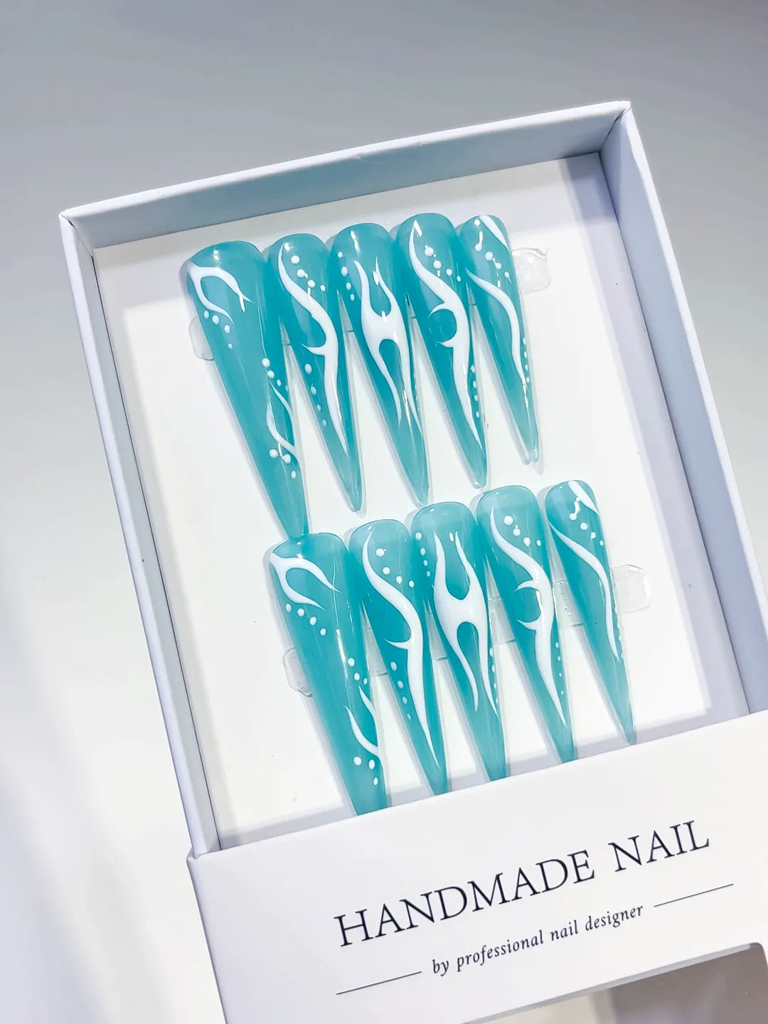 Blue White Abstract Flame press on nails angled view