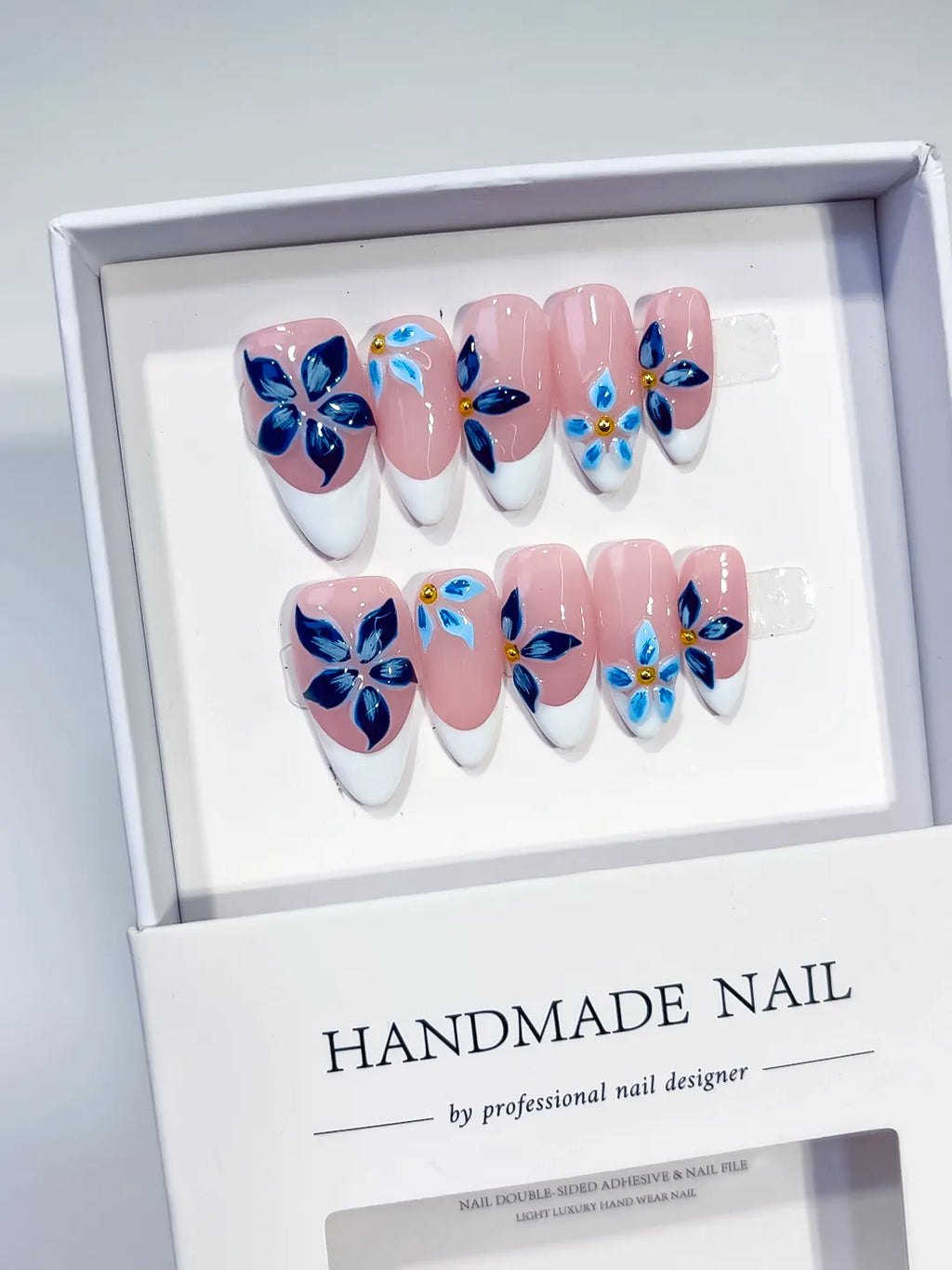 Pink White Blue Gold French tip Flower press on nails angled view