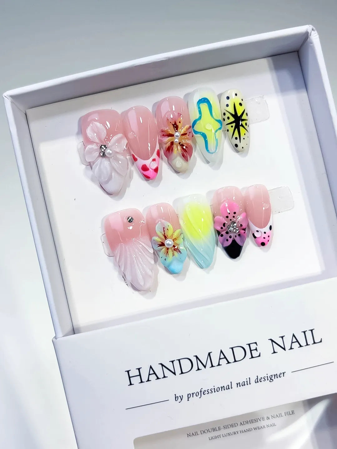 Pink White Yellow Blue Black Abstract Flower Shell Starburst 3D press on nails angled view