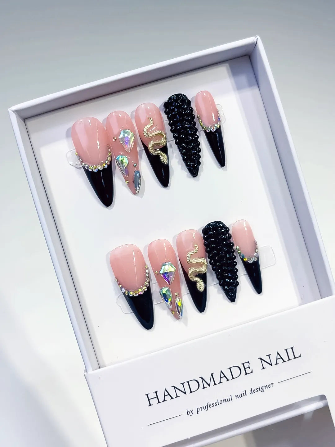 Nude Black Silver Gold French tip Rhinestone Snake press on nails angled view