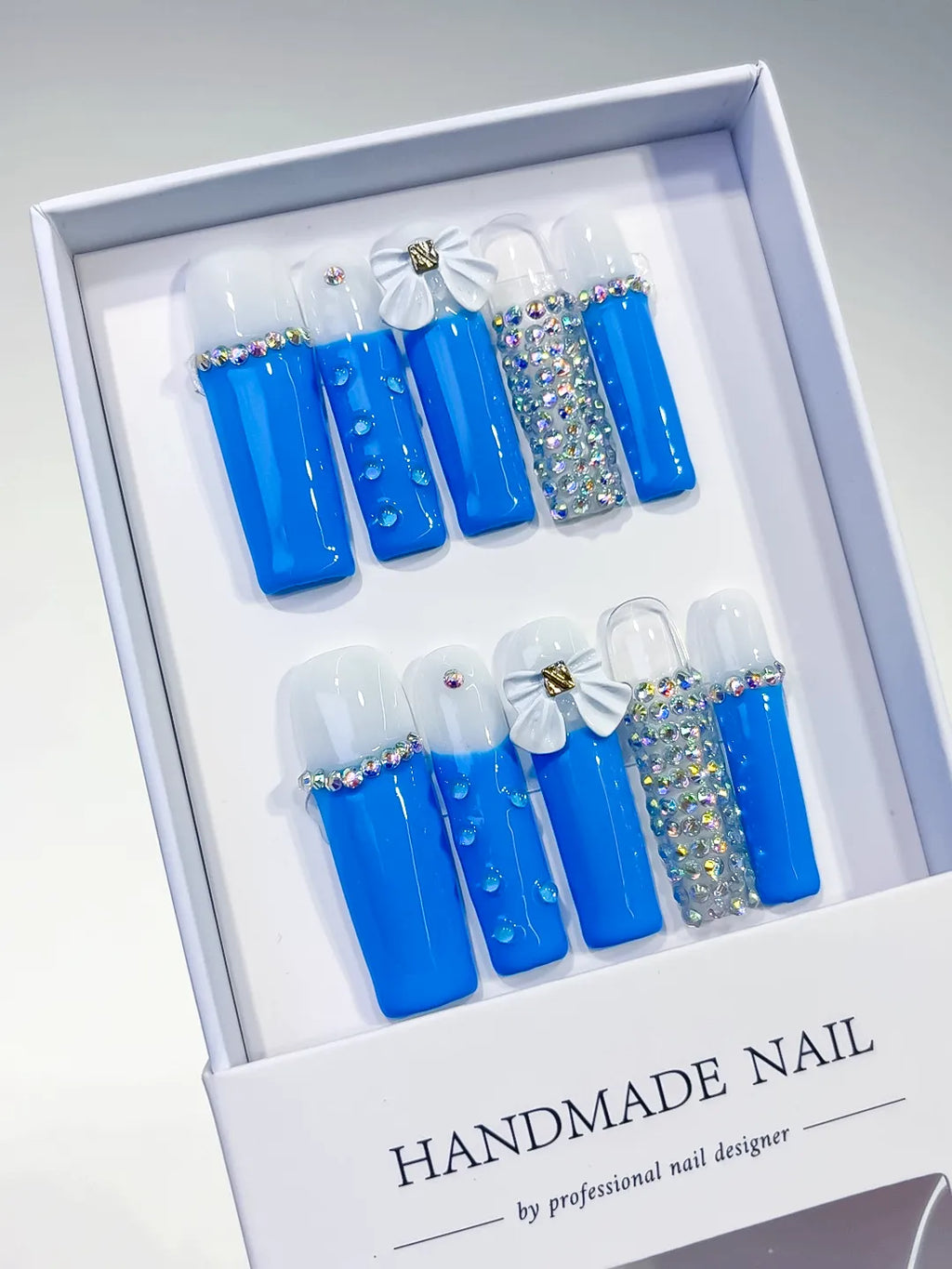 Blue White Silver Solid color Bow Rhinestone press on nails angled view