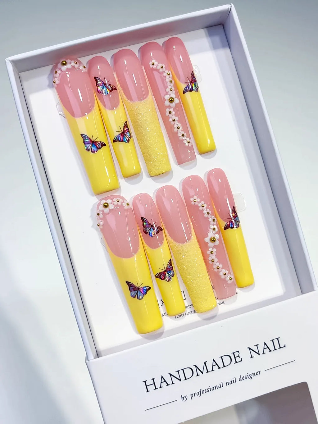Nude White Silver French tip Flower Rhinestone press on nails angled view