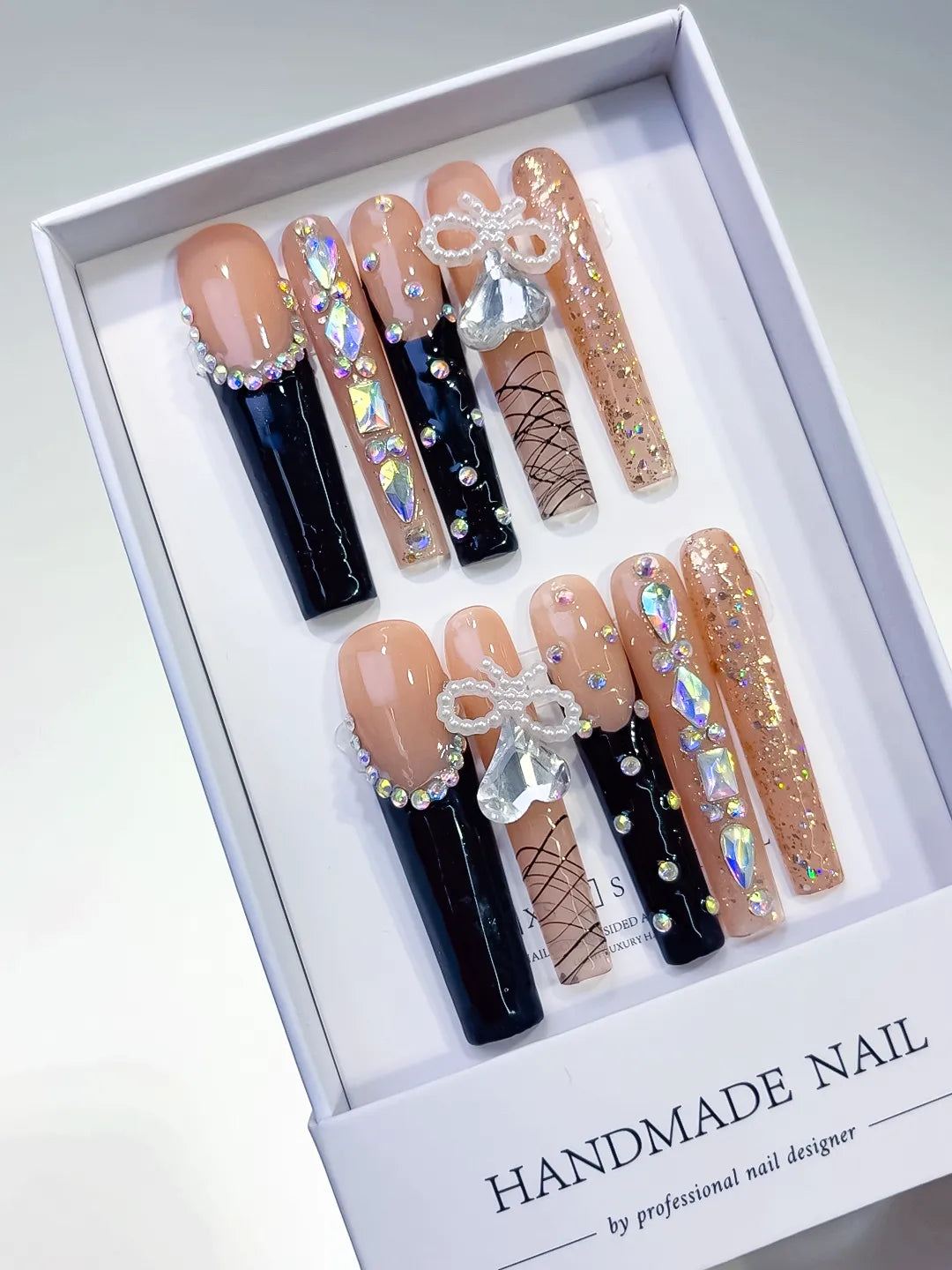 Nude Black Gold Silver French tip Bow Rhinestone Glitter press on nails angled view