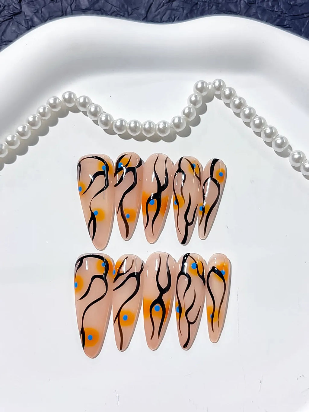 Nude Orange Black Blue Abstract Dot Pattern press on nails detail view