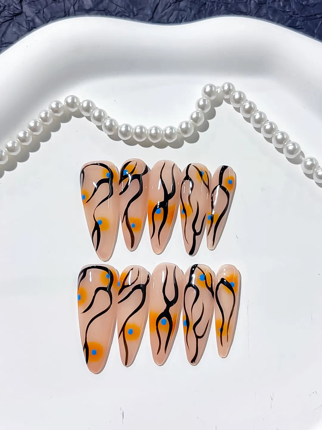 Nude Orange Black Blue Abstract Dot Pattern press on nails detail view