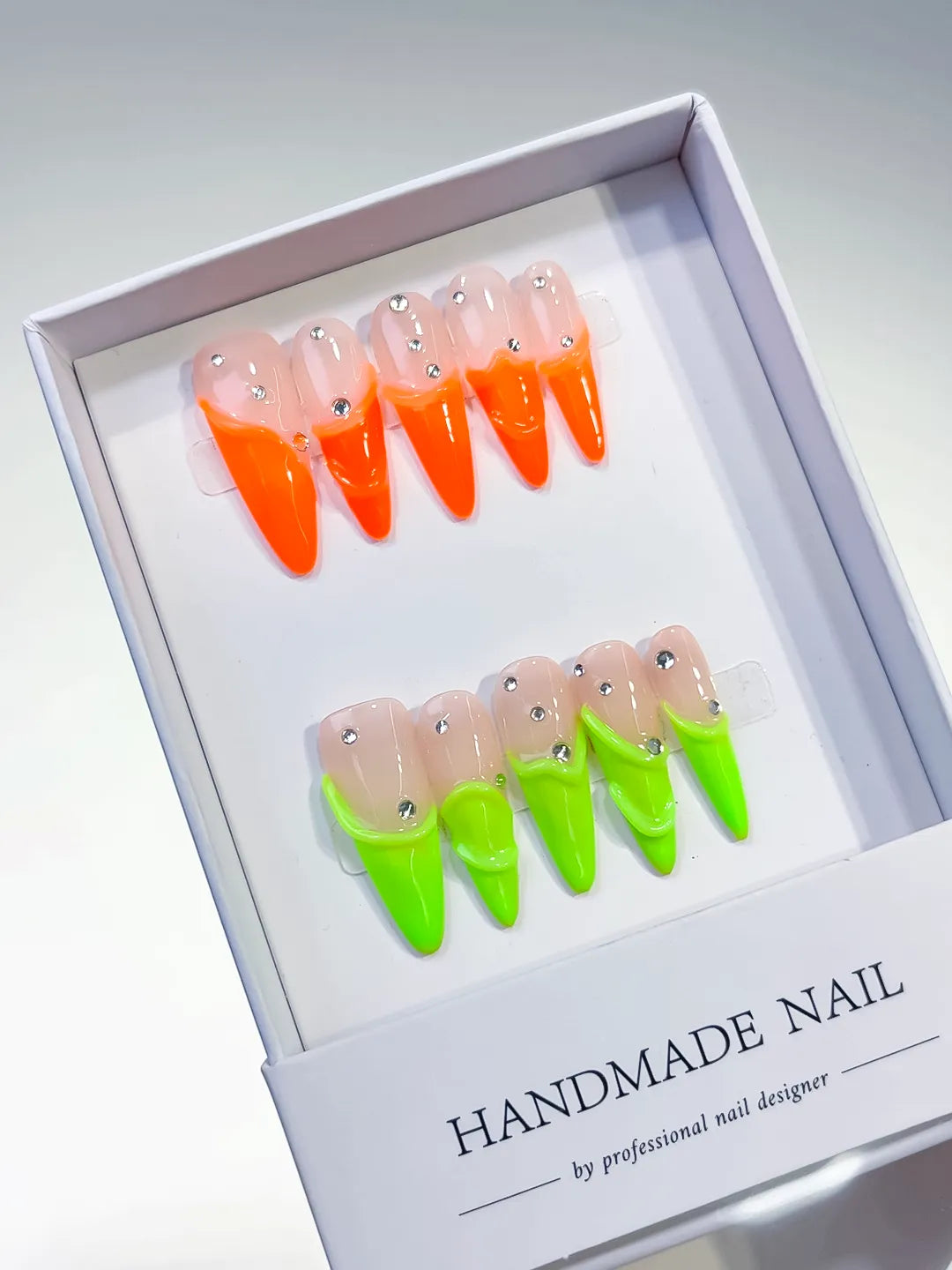 Nude Orange Green French tip Rhinestone press on nails angled view