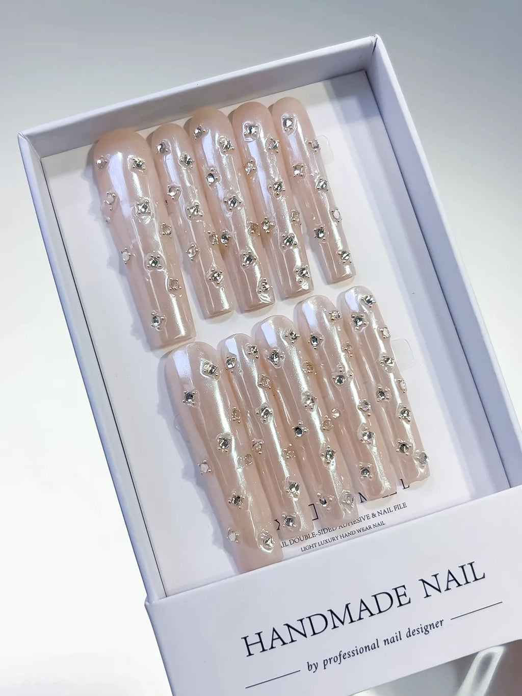 Nude White Silver Holographic Rhinestone press on nails angled view