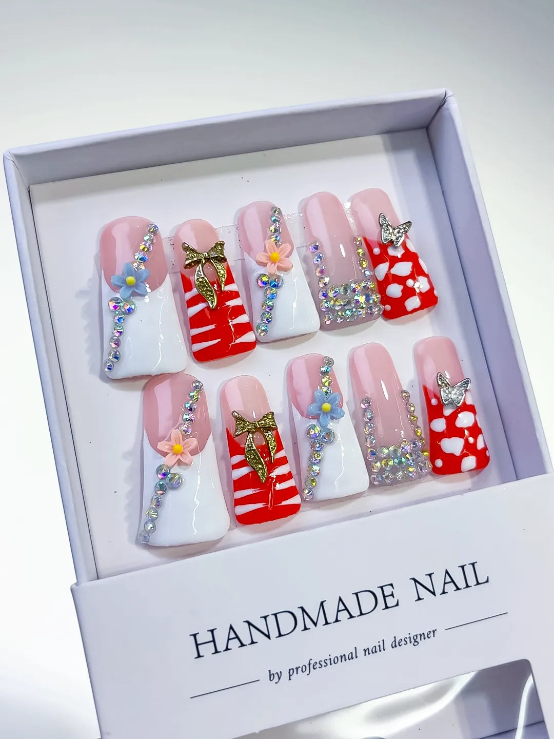 Nude White Red Pink Gold Silver Abstract Flower Butterfly Rhinestone press on nails angled view