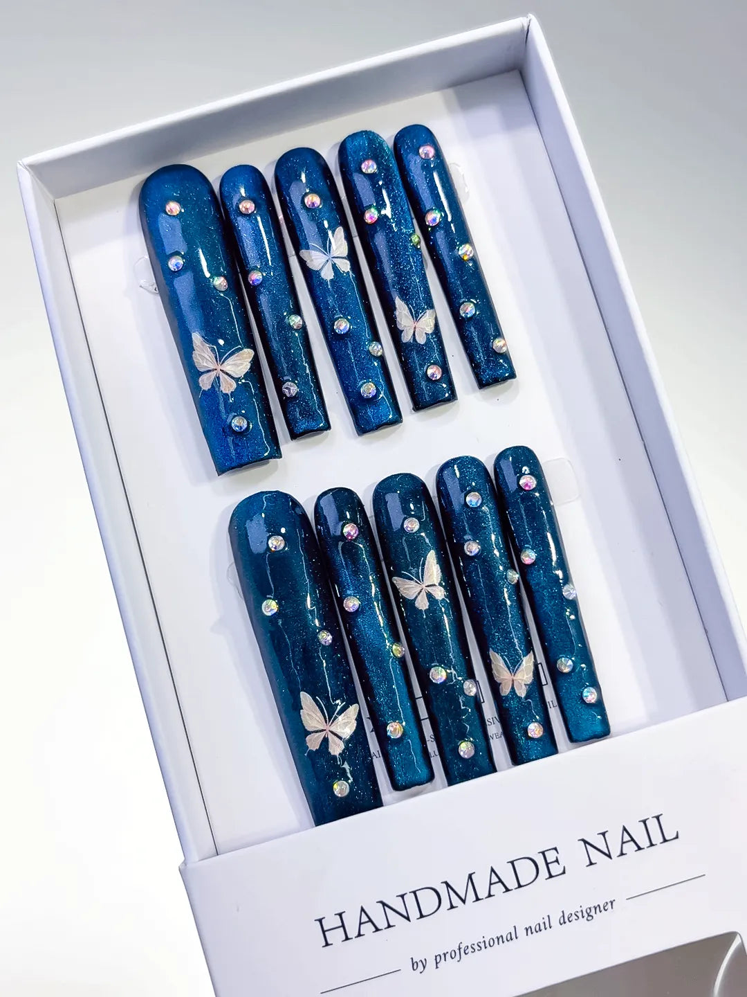 Blue Silver Metallic Butterfly Rhinestone press on nails angled view