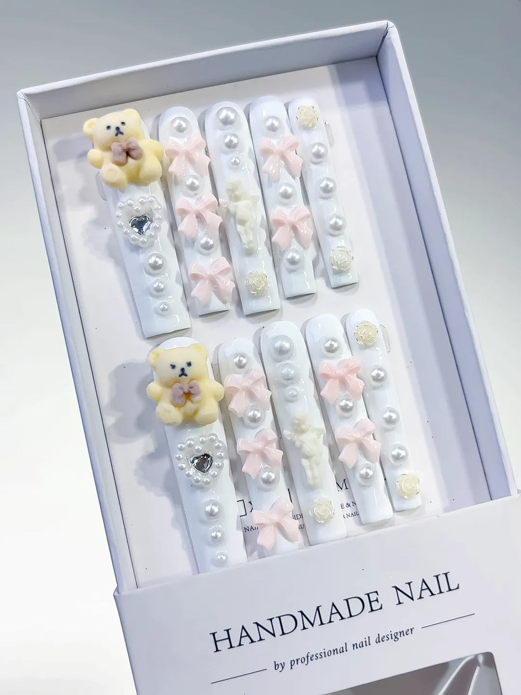 White Pink Yellow Silver Solid color Bear Bow Flower Heart Pearl 3D press on nails angled view