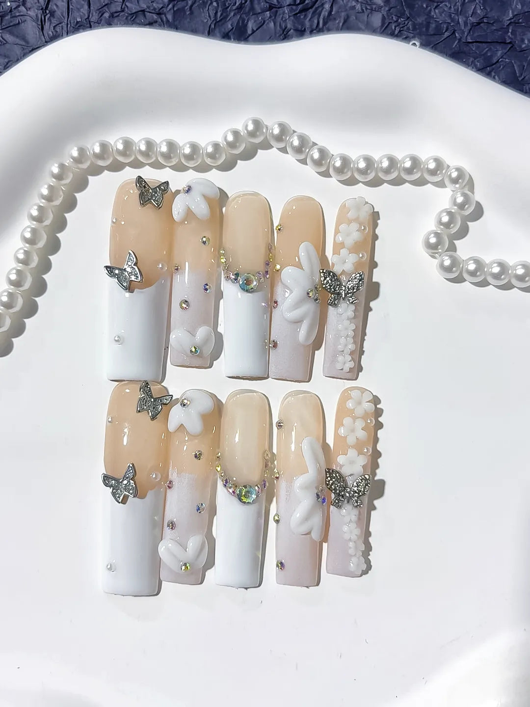 Nude White Silver Gold French tip Bow Pearl Rhinestone press on nails detail view