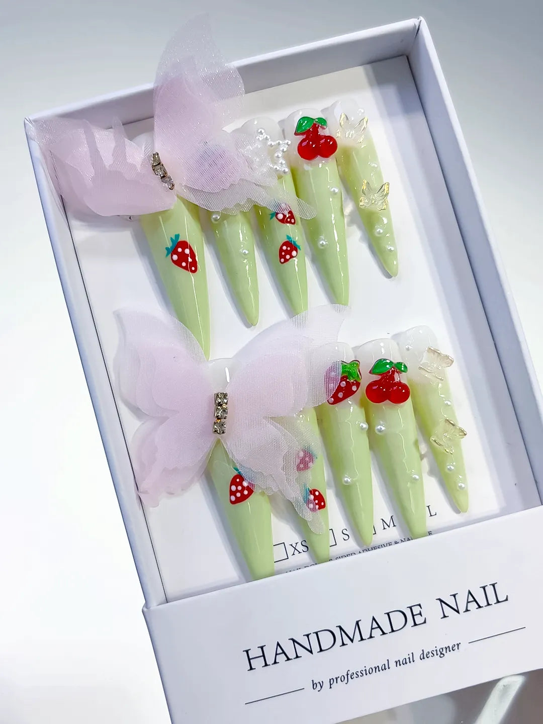 Green Red White Pink Solid color Bow Strawberry Cherry Flower Pearl 3D press on nails angled view
