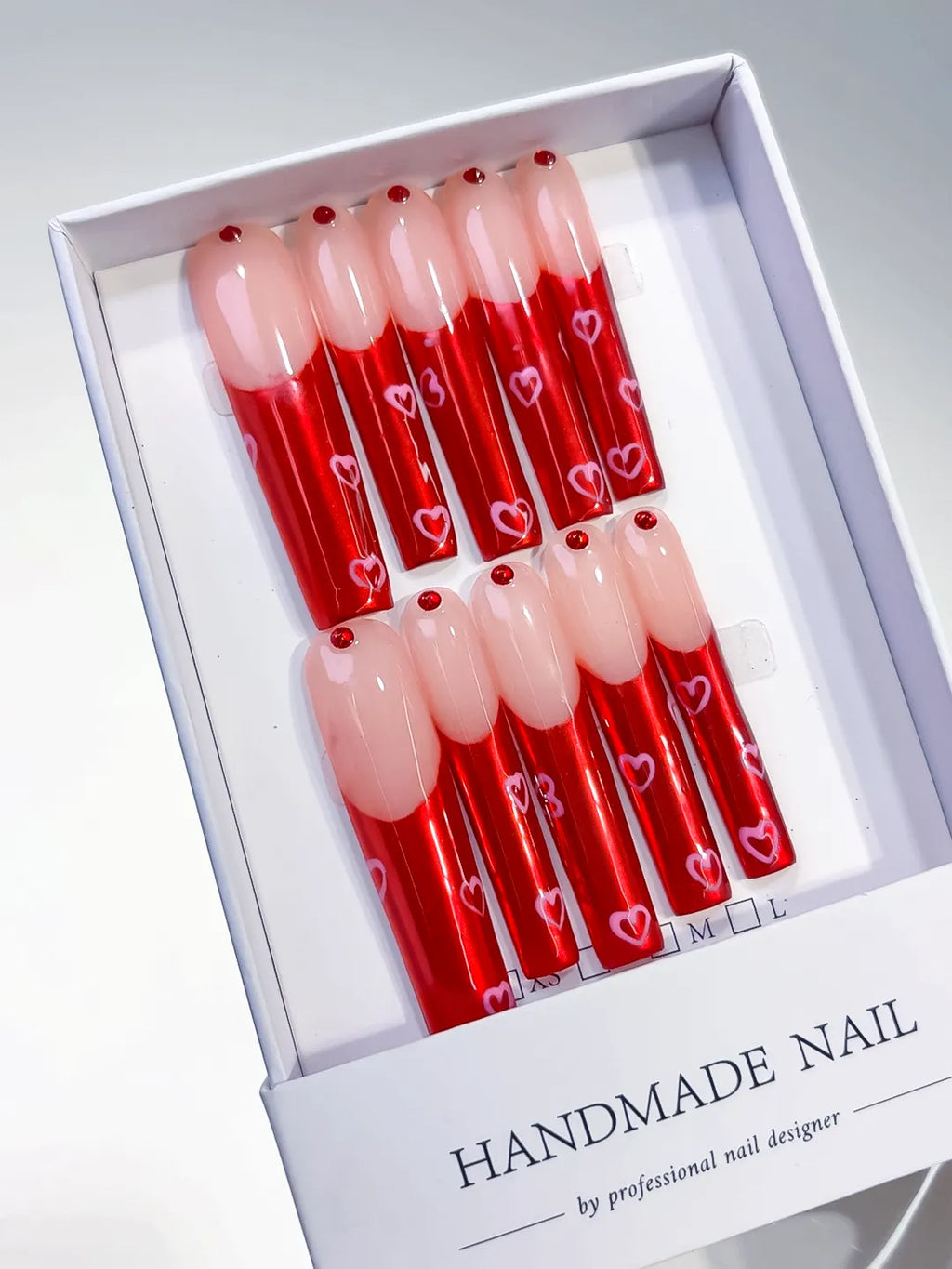 Nude Red Silver Solid color Rhinestone press on nails angled view