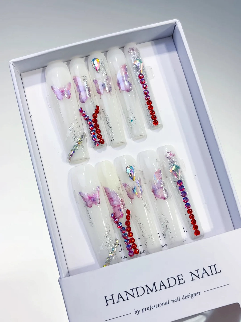 White Pink Red Silver Solid color Butterfly Rhinestone press on nails angled view