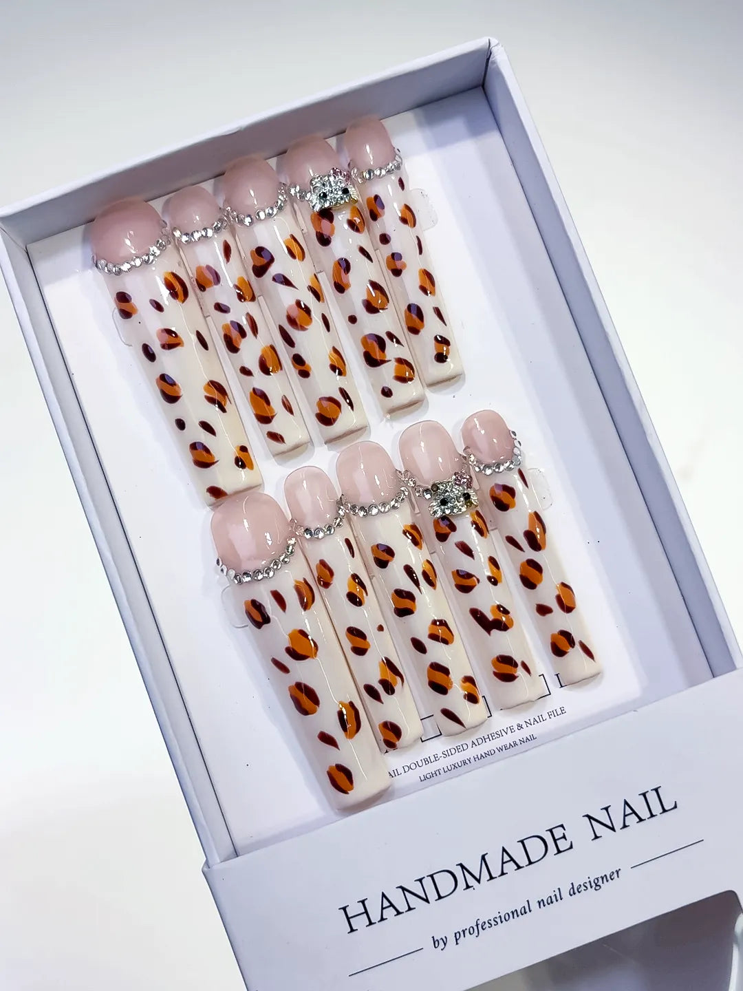 White Brown Black Silver Abstract Animal Print Rhinestone press on nails angled view