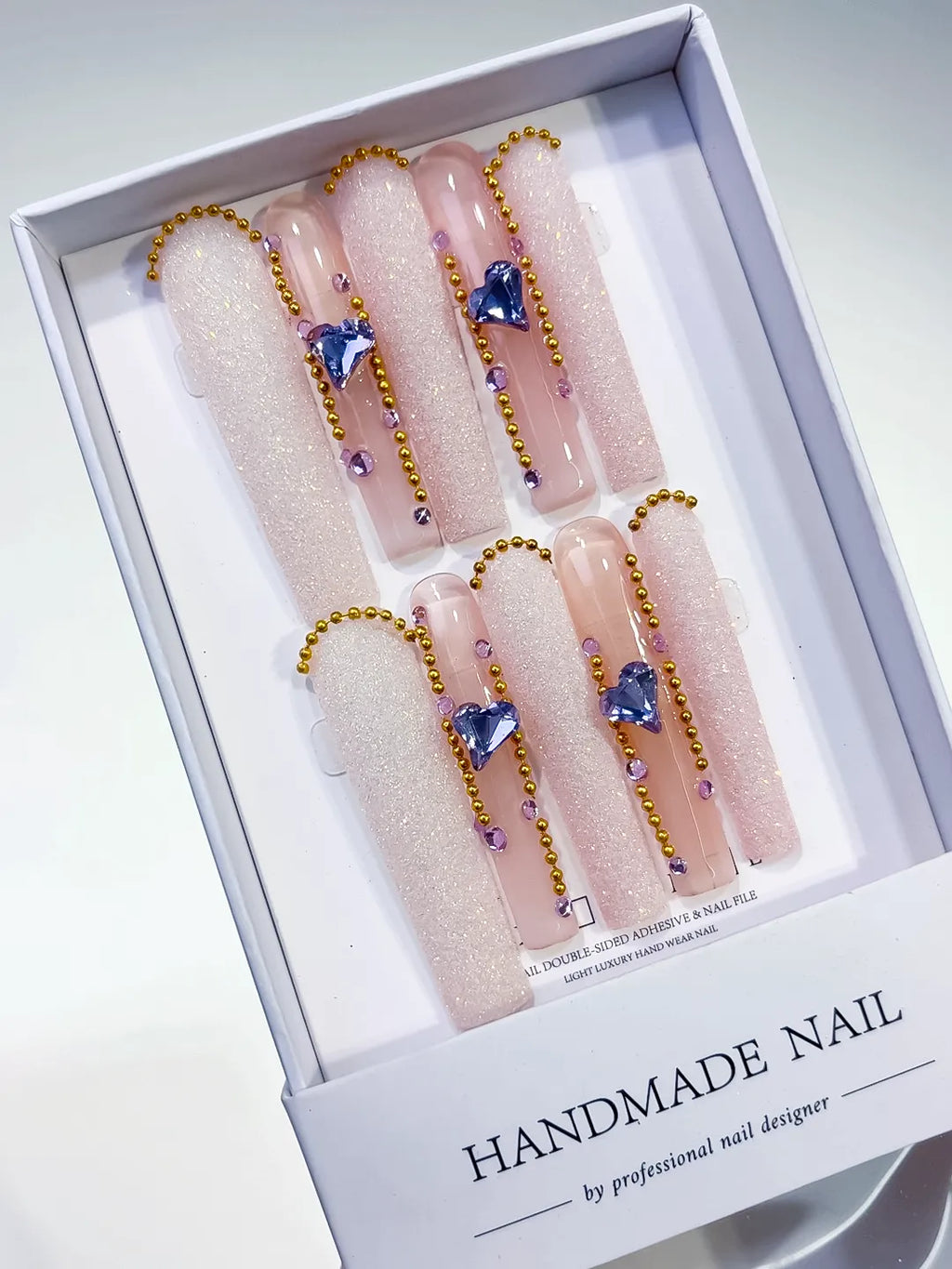 Nude White Gold Purple Glitter Heart Rhinestone Pearl press on nails angled view