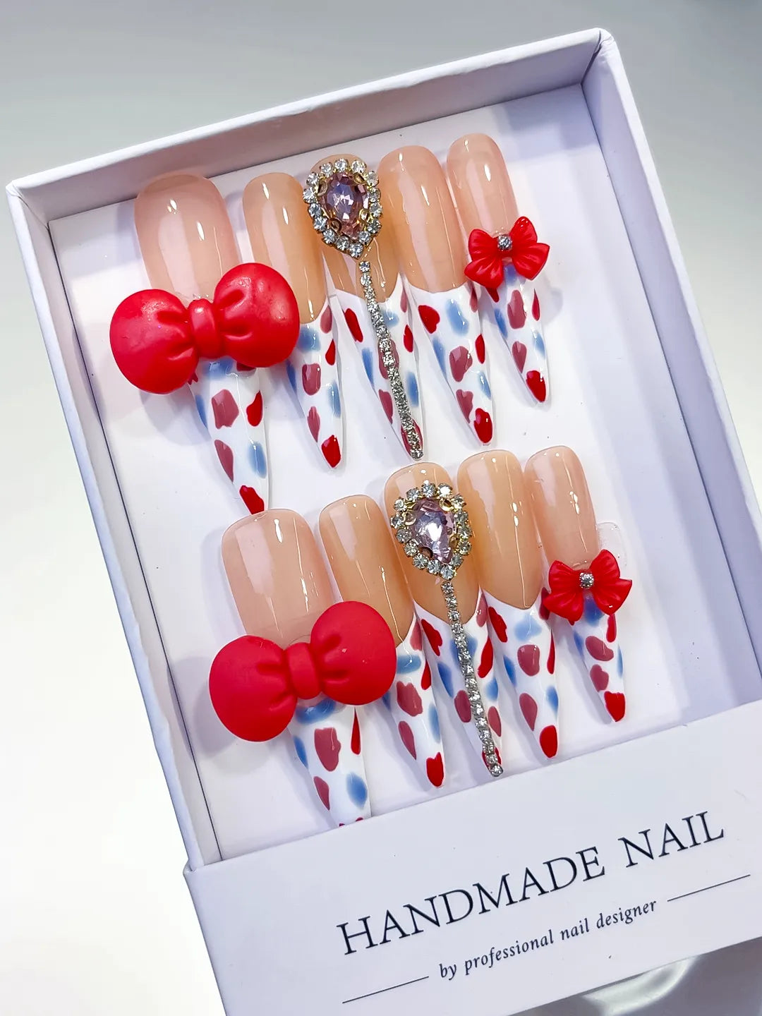 Nude White Red Blue Silver Abstract Bow Heart Rhinestone 3D press on nails angled view